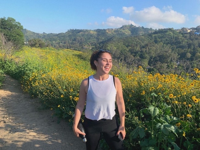 Brenna D'Amico as seen while posing for a picture with a stunning backdrop in April 2019