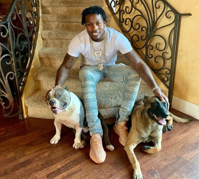 CJ So Cool with his dogs as seen in May 2019