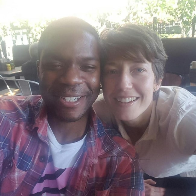 Carrie Coon as seen while smiling in a selfie alongside Jovan Adepo in Los Angeles, California in February 2017