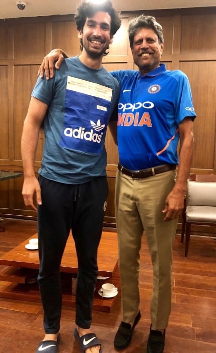 Dhairya Karwa (Left) as seen while smiling for a picture alongside Kapil Dev in 2019