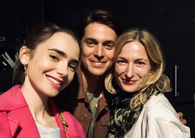 From Left to Right - Lily Collins, Lucas Bravo, and Zoe Cassavetes smiling for a selfie in Paris, France in September 2019