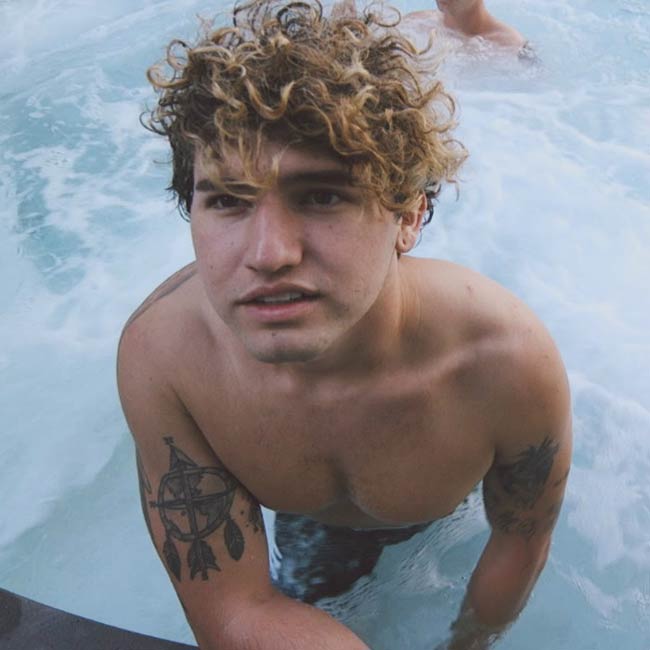 JC Caylen shirtless in a pool as seen in 2016
