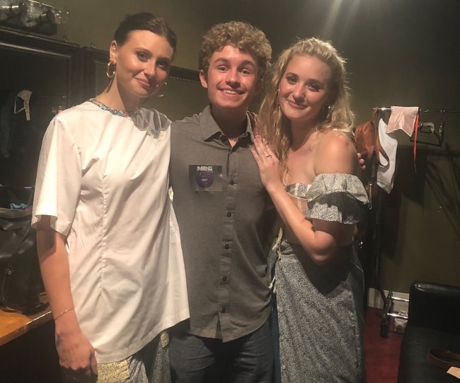 Sean Giambrone (Center) as seen while posing with the members of the pop rock duo, 'Aly & AJ', in Vancouver in June 2018