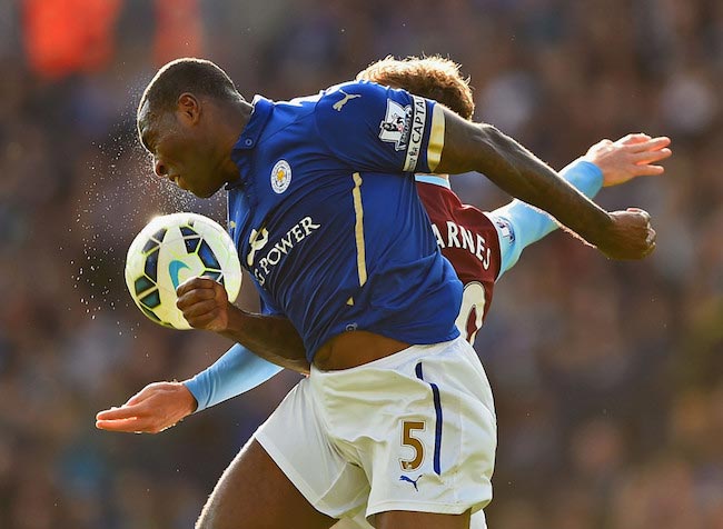 Wes Morgan in duel with Burnley&rsquo;s player Ashley Barnes in a league match between Leicester City and Burnley on October 4, 2014